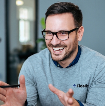 Smiling businessman explaining something with hands