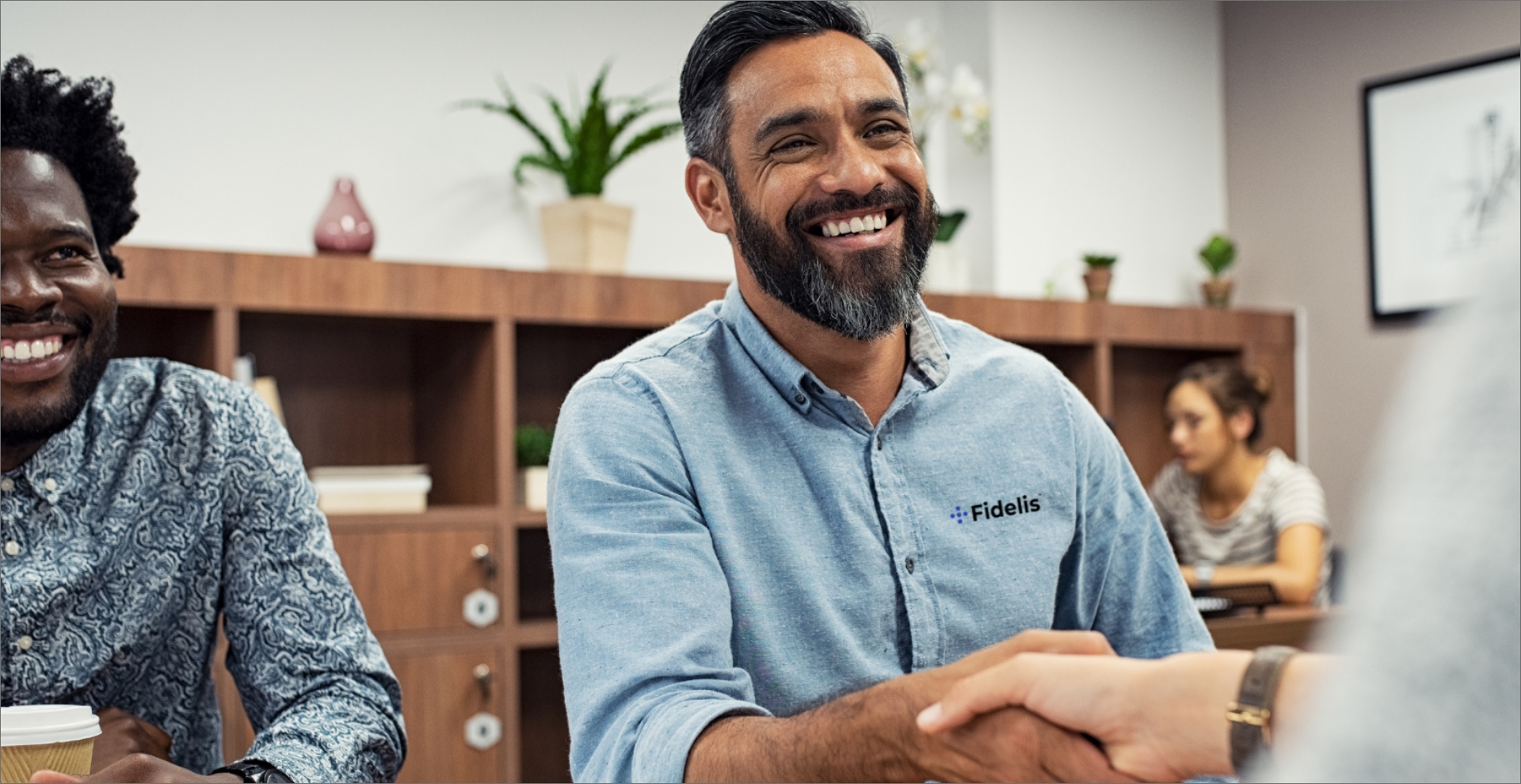 Business man with a genuine smile shaking hands someone