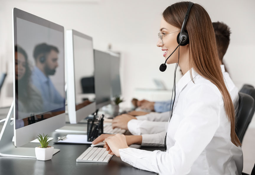 Smiling Businesswoman Fidelis Support with Computer and headset